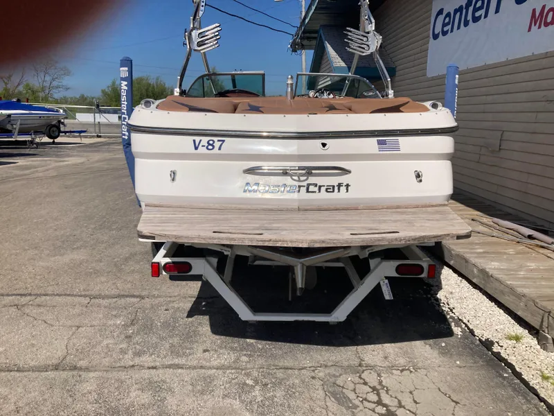 Slide: The Image of 2008 MasterCraft MariStar 215 boat on trailer, rear view, parked at a dealership. - 6