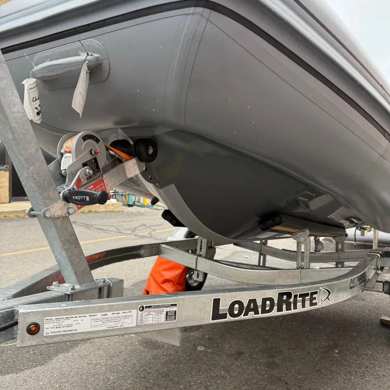 Slide: The Image of 2023 Highfield CL290 boat on LoadRite trailer, close-up view. - 3