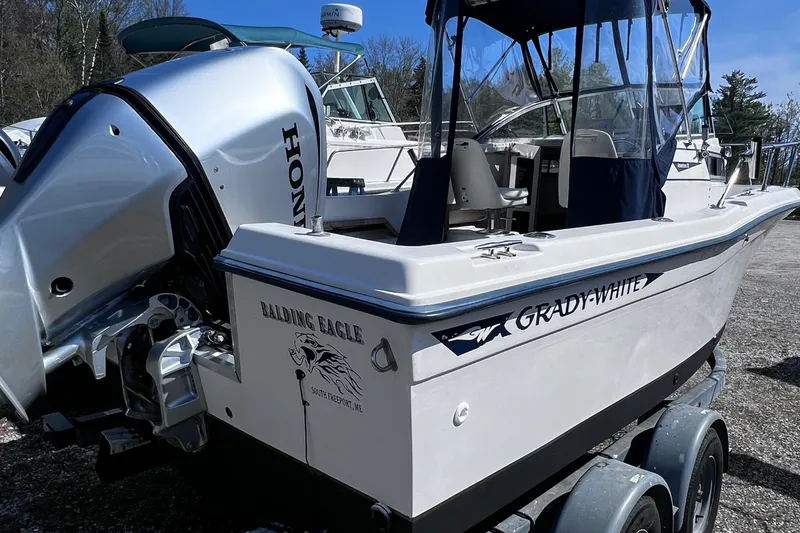 Slide: The Image of 1994 Grady-White 20 Adventure boat with Honda outboard motor on trailer. - 11