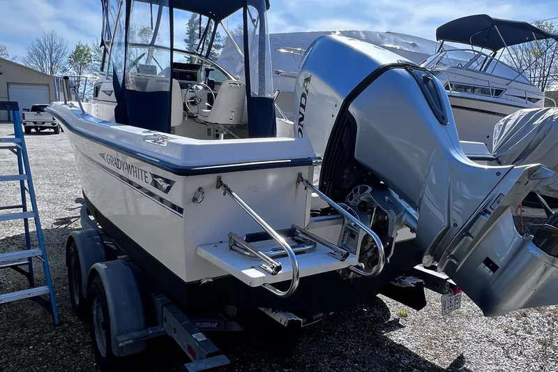 Slide: The Image of 1994 Grady-White 20 Adventure boat with Honda outboard motor on trailer. - 4