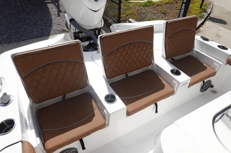 Slide: The Image of 2026 Sea Hunt BX 25 FS boat with brown cushioned seats and cup holders. - 10
