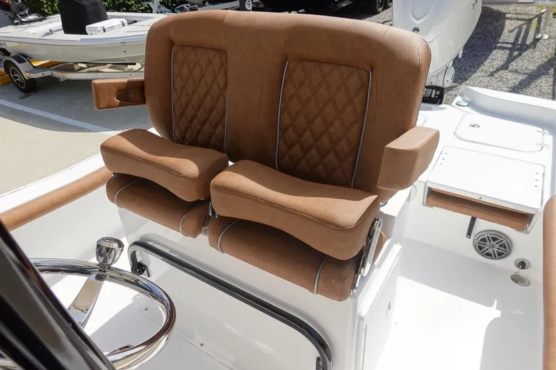 Slide: The Image of Luxurious seating on 2026 Sea Hunt BX 25 FS boat, featuring brown leather upholstery. - 14