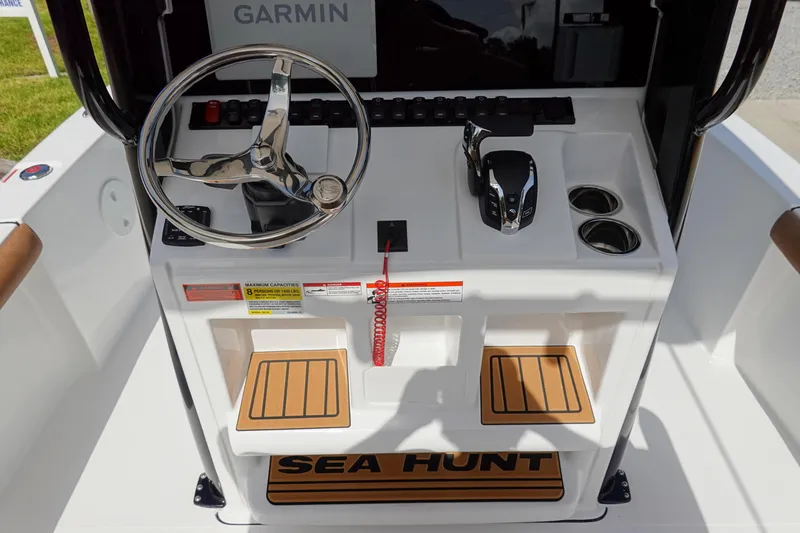 Slide: The Image of 2026 Sea Hunt BX 25 FS boat console with steering wheel and controls. - 16