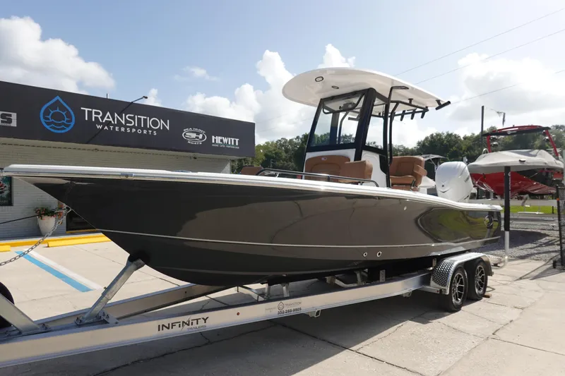 Slide: The Image of 2026 Sea Hunt BX 25 FS boat on trailer at Transition Watersports dealership. - 2