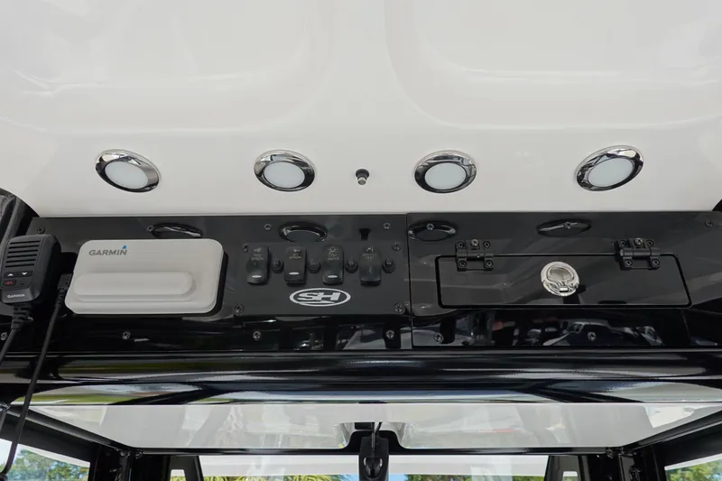 Slide: The Image of 2026 Sea Hunt BX 25 FS boat console with Garmin device and control panel. - 21