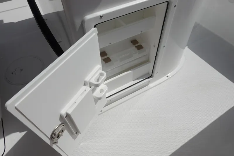 Slide: The Image of Open storage compartment on 2026 Sea Hunt BX 25 FS boat. - 24