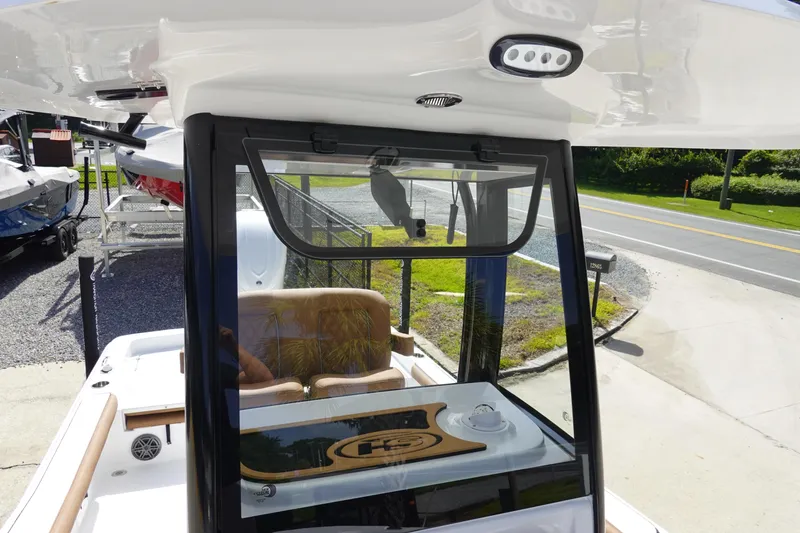 Slide: The Image of 2026 Sea Hunt BX 25 FS boat with open console and seating, displayed outdoors. - 25