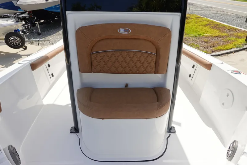 Slide: The Image of 2026 Sea Hunt BX 25 FS boat interior with brown cushioned seating. - 26