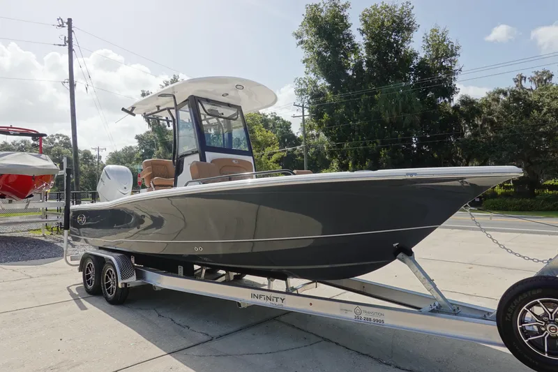 Slide: The Image of 2026 Sea Hunt BX 25 FS boat on trailer, parked outdoors, sunny day. - 3