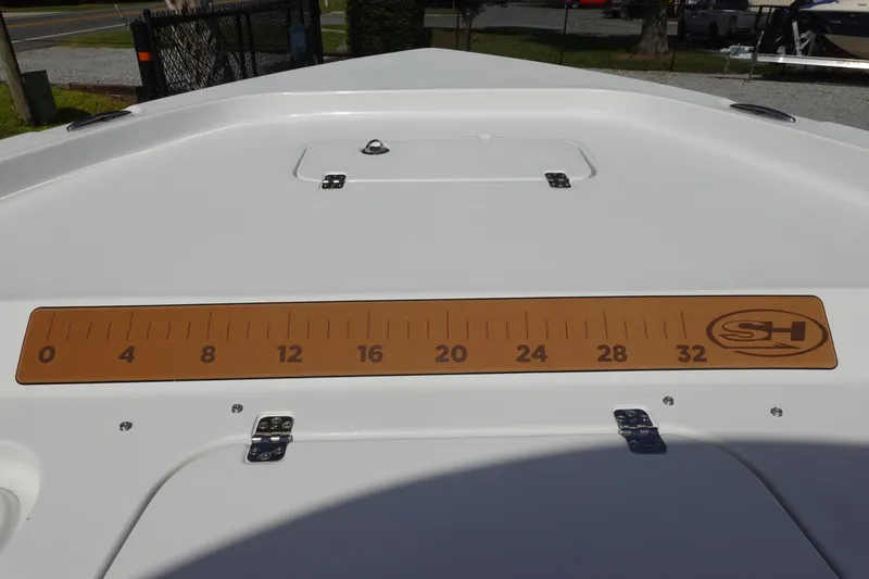 Slide: The Image of 2026 Sea Hunt BX 25 FS boat deck with measuring ruler and hatch. - 31