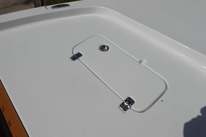 Slide: The Image of 2026 Sea Hunt BX 25 FS boat deck with hatch and ruler markings. - 34