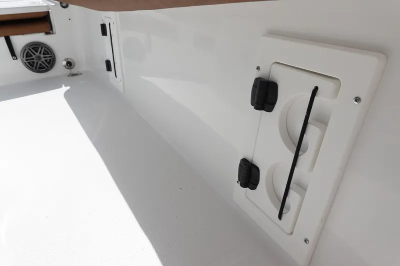 Slide: The Image of 2026 Sea Hunt BX 25 FS boat interior with speaker and storage compartment. - 37