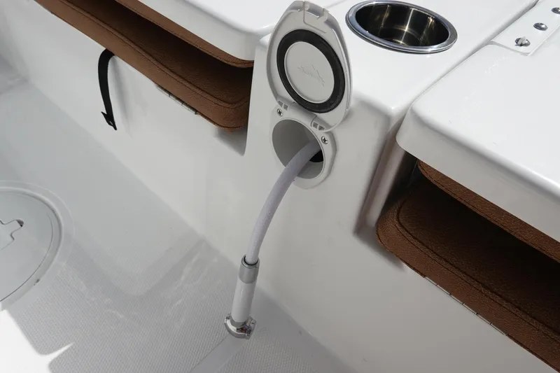 Slide: The Image of 2026 Sea Hunt BX 25 FS boat with hose storage and cup holder. - 39