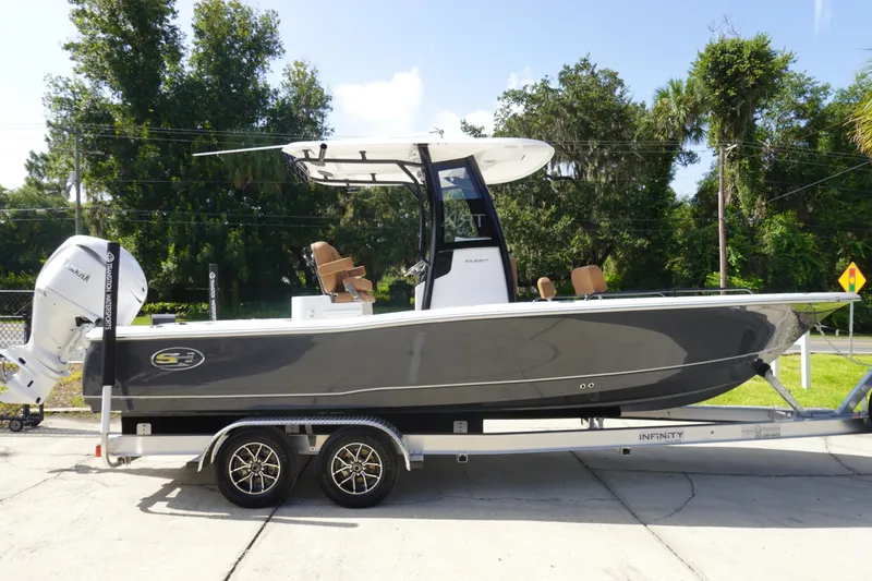 Slide: The Image of 2026 Sea Hunt BX 25 FS boat on trailer, parked outdoors. - 4