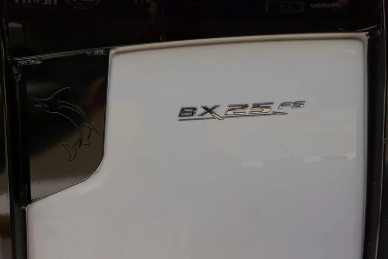 Slide: The Image of 2026 Sea Hunt BX 25 FS boat emblem on white surface. - 40