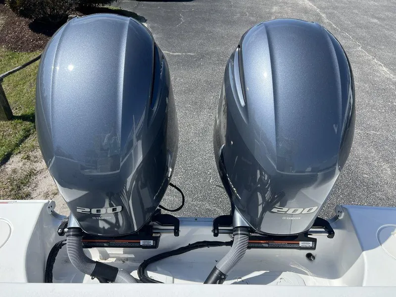 Slide: The Image of Twin 200 horsepower outboard engines on a 2022 Sea Hunt Gamefish 27 boat. - 18