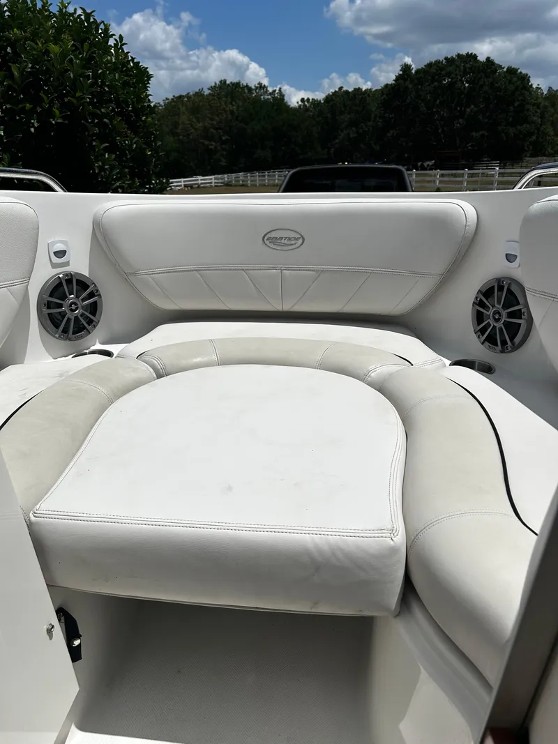 Slide: The Image of 2008 Ebbtide 2700 SS Bow Rider/CD interior with white seating and speakers. - 16