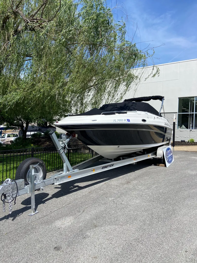Slide: The Image of 2008 Ebbtide 2700 SS Bow Rider on trailer, parked outdoors. - 2