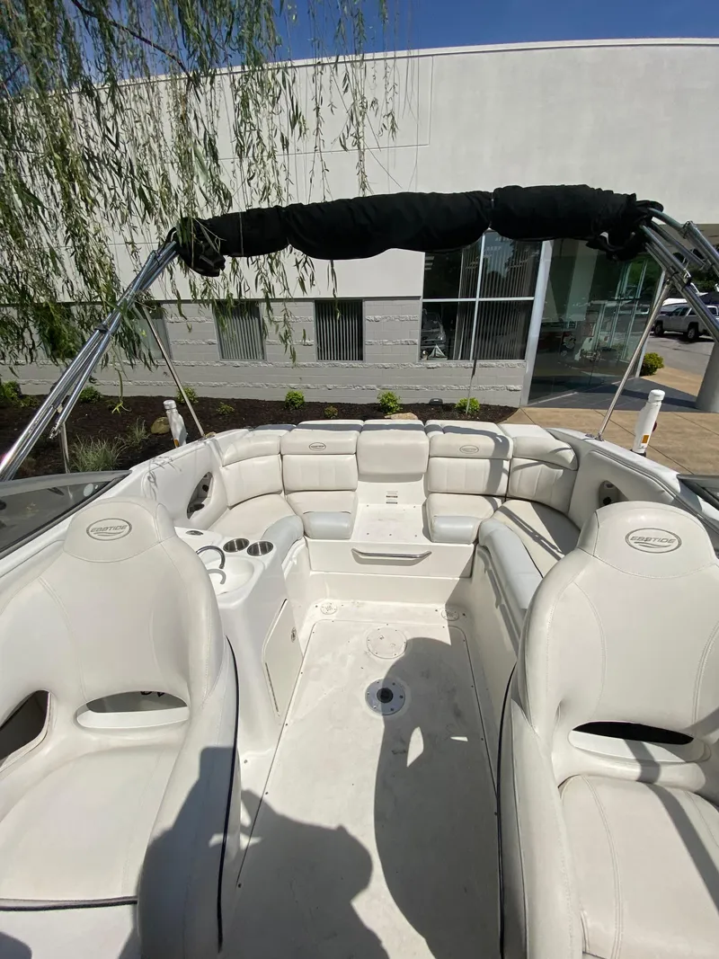 Slide: The Image of 2008 Ebbtide 2700 SS Bow Rider/CD boat interior with white seating and canopy. - 7