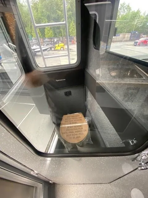 Slide: The Image of 2024 Spartan 2800 Olympia interior with a compact, modern design and large windows. - 1