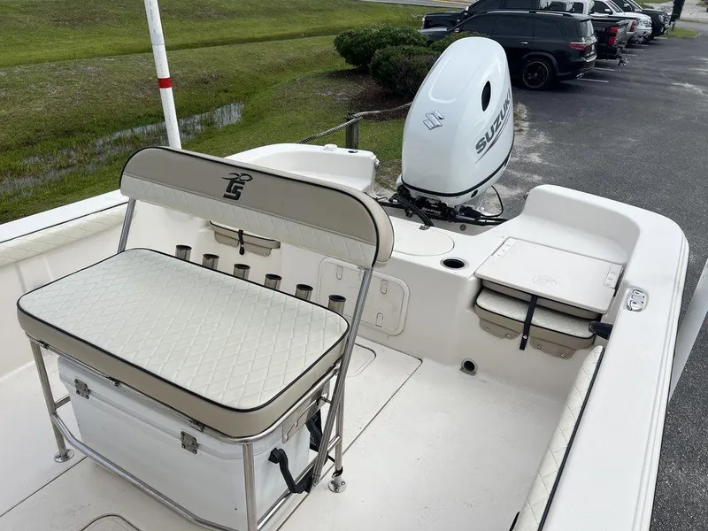 Slide: The Image of 2023 Carolina Skiff 21 LS boat with seating and Suzuki outboard motor. - 11