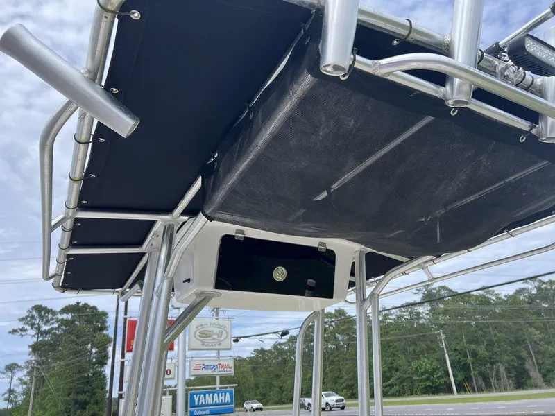 Slide: The Image of 2023 Carolina Skiff 21 LS boat with T-top and storage compartment. - 15