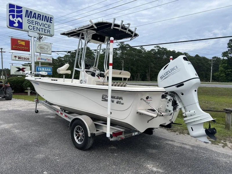 Slide: The Image of 2023 Carolina Skiff 21 LS boat with Suzuki outboard at marine service center. - 3