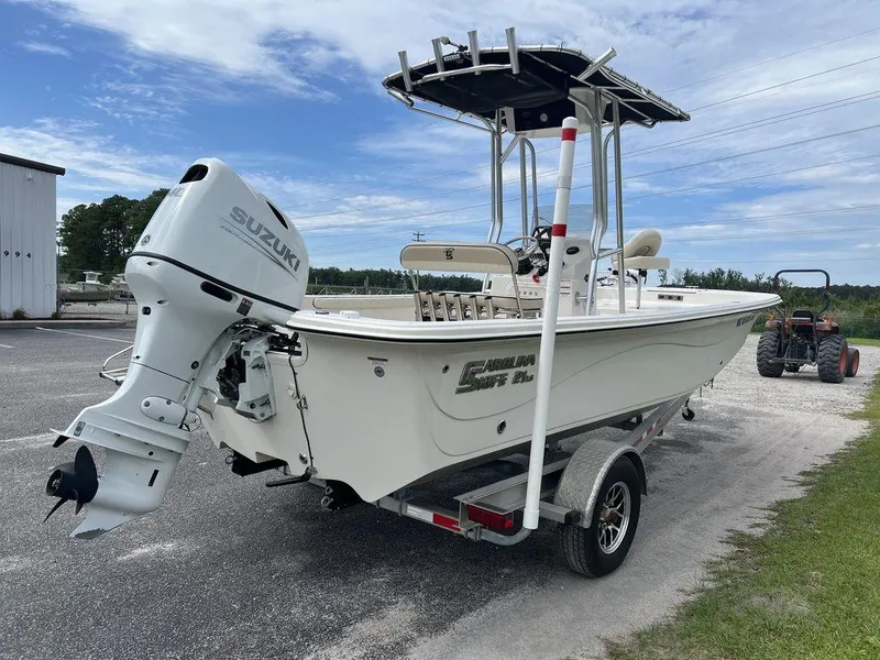 Slide: The Image of 2023 Carolina Skiff 21 LS boat with Suzuki outboard motor on trailer. - 6
