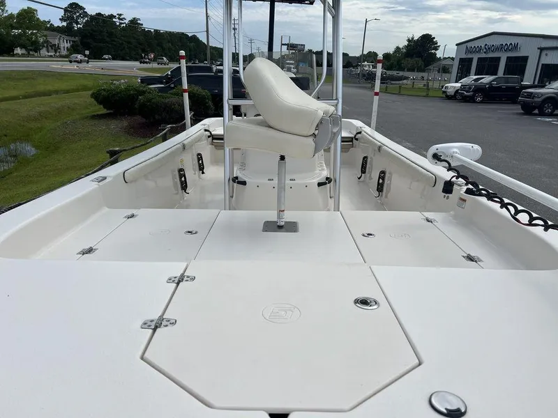 Slide: The Image of 2023 Carolina Skiff 21 LS boat interior with seating and storage compartments. - 7