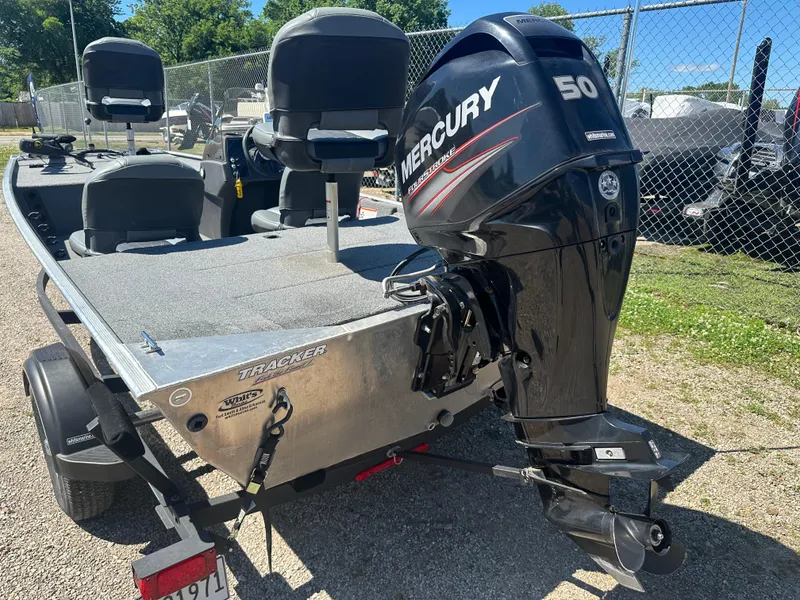 Slide: The Image of 2019 Tracker Classic boat with Mercury 50 HP engine, parked on a trailer. - 15