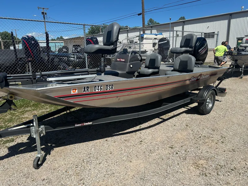 Slide: The Image of 2019 Tracker Classic boat on trailer, parked outdoors near a fence. - 5