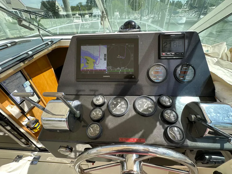 Slide: The Image of Control panel of a 1994 Bertram 30 Express Fisherman boat with navigation instruments. - 20