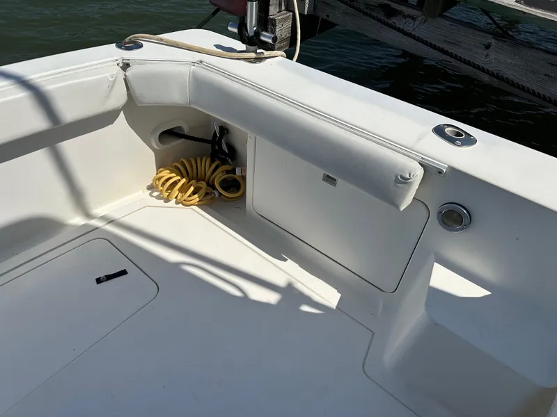 Slide: The Image of 1994 Bertram 30 Express Fisherman boat deck with coiled yellow hose. - 26