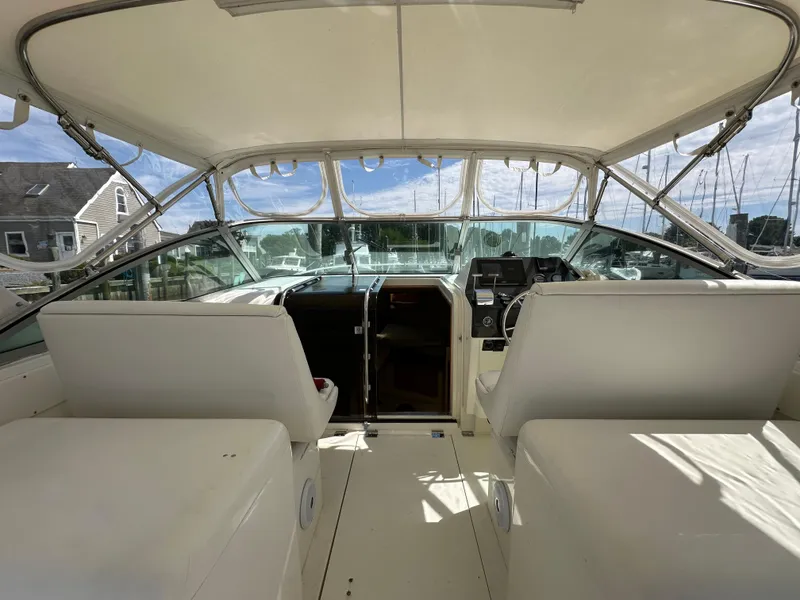 Slide: The Image of 1994 Bertram 30 Express Fisherman boat interior with helm and seating area. - 4