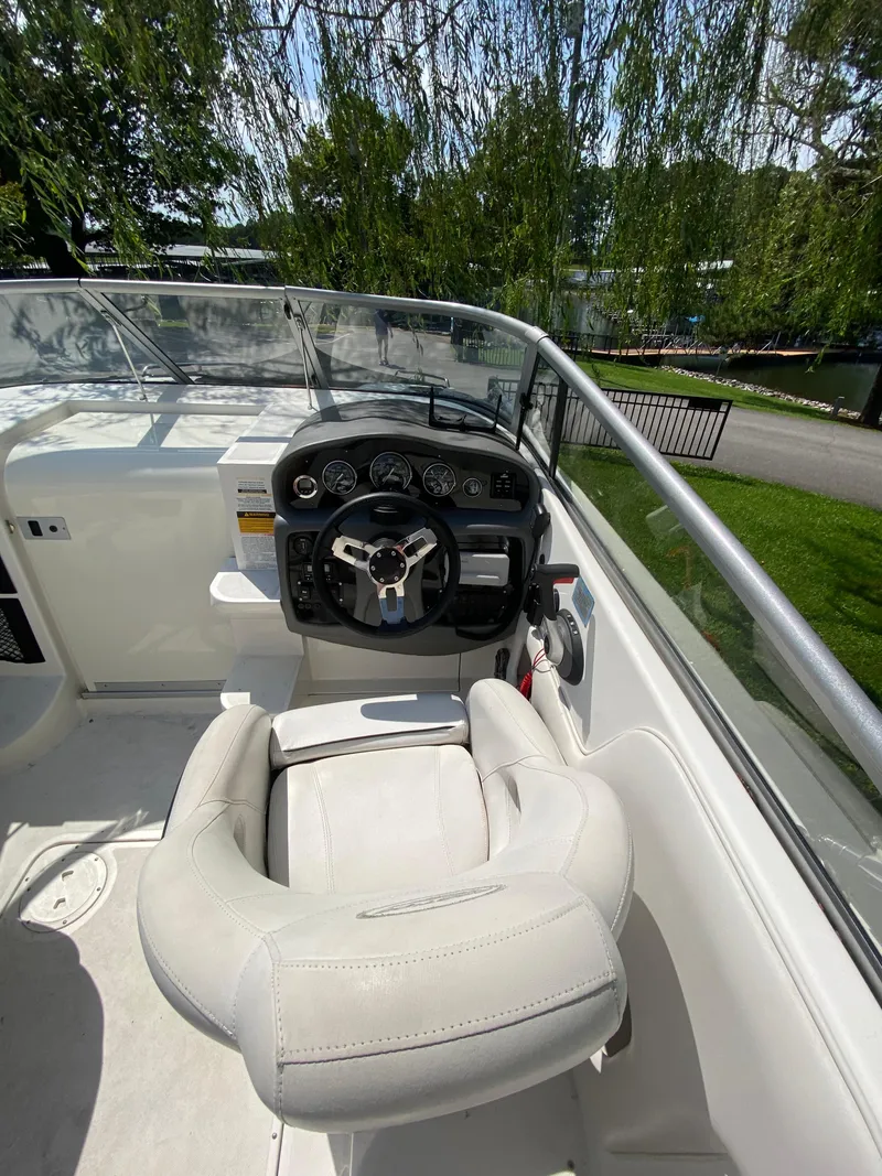 Slide: The Image of 2008 Ebbtide 2700 Cuddy Bow Rider cockpit with steering wheel and controls. - 5