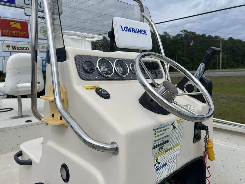 Slide: The Image of 2014 Alumacraft 18' All Welds MV 1860 CC boat console with steering wheel and Lowrance display. - 10