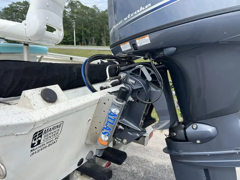 Slide: The Image of 2014 Alumacraft 18' boat with outboard motor and hydraulic steering system. - 12