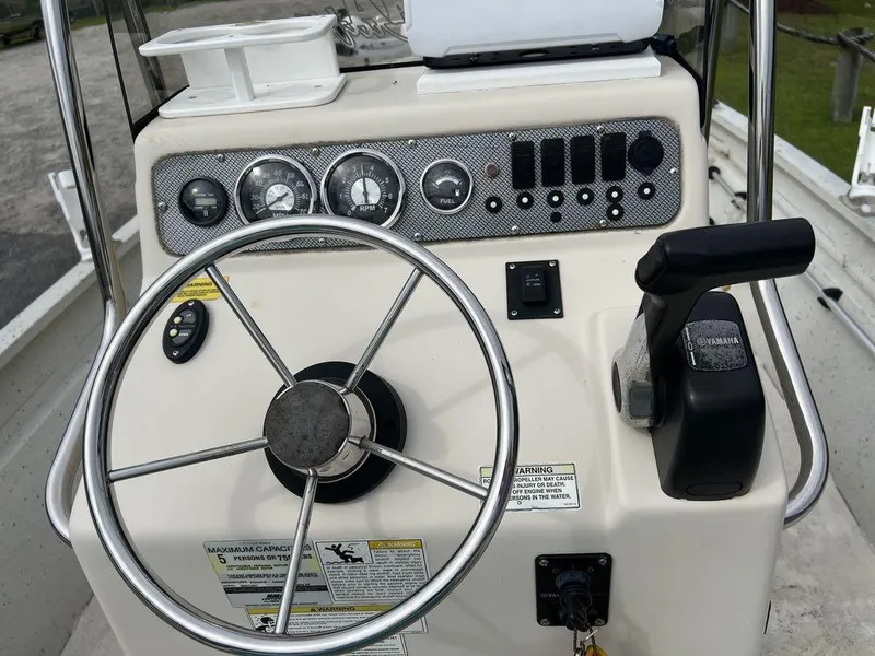 Slide: The Image of 2014 Alumacraft 18' All Welds MV 1860 CC boat console with steering wheel and controls. - 14