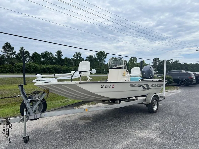 Slide: The Image of 2014 Alumacraft 18' All Welds MV 1860 CC boat on trailer, parked outdoors. - 2