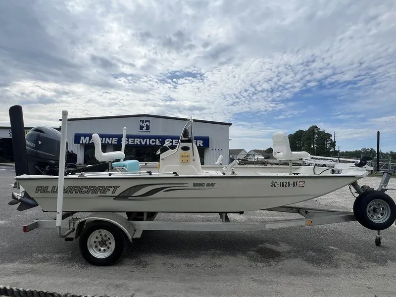 Slide: The Image of 2014 Alumacraft 18' All Welds MV 1860 CC boat on trailer, parked at marine service center. - 4