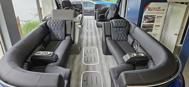 Slide: The Image of 2025 Bennington Q 25 QFBA luxury boat interior with plush seating and modern design. - 11