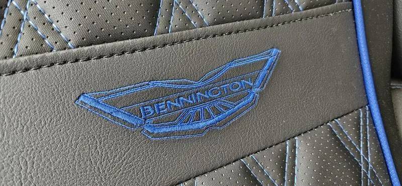 Slide: The Image of 2025 Bennington Q 25 QFBA logo on stitched leather upholstery. - 12