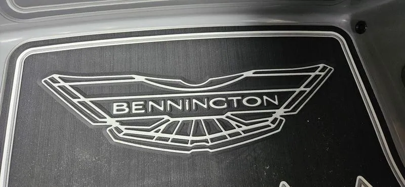 Slide: The Image of 2025 Bennington Q 25 QFBA logo on a sleek black surface. - 13