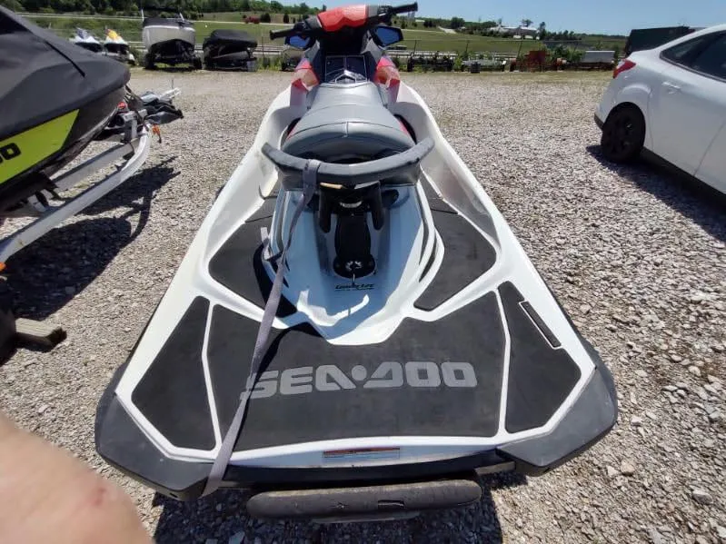 Slide: The Image of 2013 Sea-Doo Wake 155 jet ski parked on gravel lot. - 3