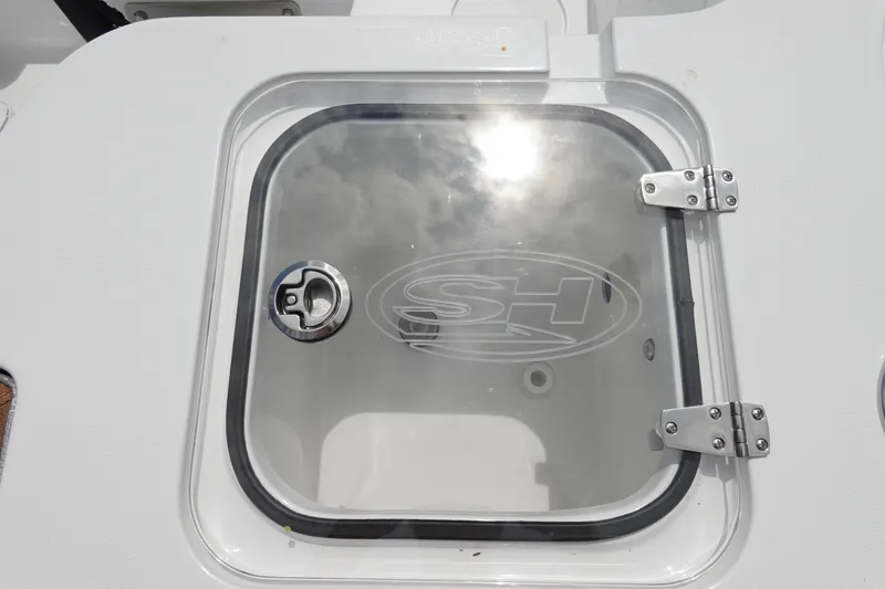 Slide: The Image of 2026 Sea Hunt Gamefish 28 FS boat deck with dual engines and storage compartments. - 10