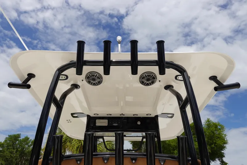 Slide: The Image of 2026 Sea Hunt Gamefish 28 FS boat with rod holders and livewell. - 16