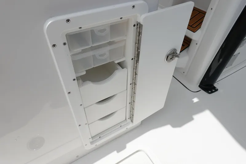 Slide: The Image of 2026 Sea Hunt Gamefish 28 FS boat with built-in storage compartment and removable bin. - 18