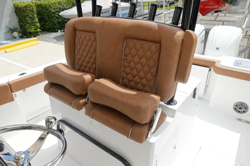 Slide: The Image of 2026 Sea Hunt Gamefish 28 FS boat interior with storage compartment and seating. - 22