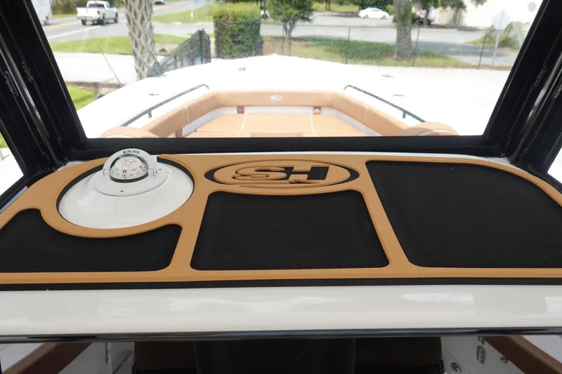 Slide: The Image of 2026 Sea Hunt Gamefish 28 FS dashboard with dual Garmin displays and modern controls. - 27