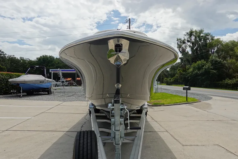 Slide: The Image of 2026 Sea Hunt Gamefish 28 FS boat on trailer, sleek design, parked outdoors. - 3